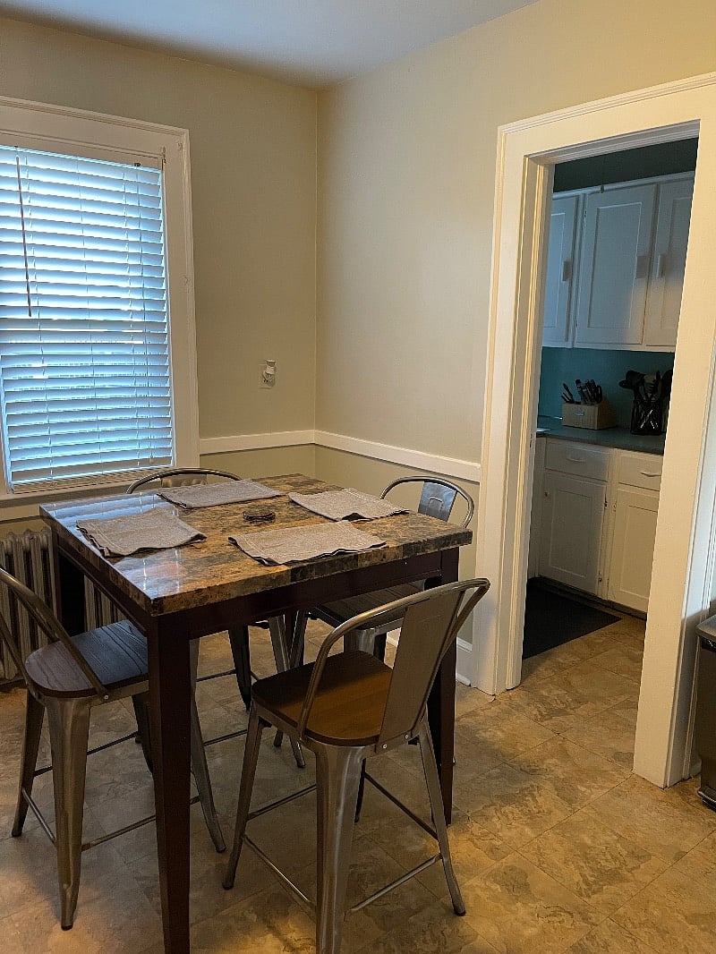 Bar height table and chairs for seating in kitchen. 