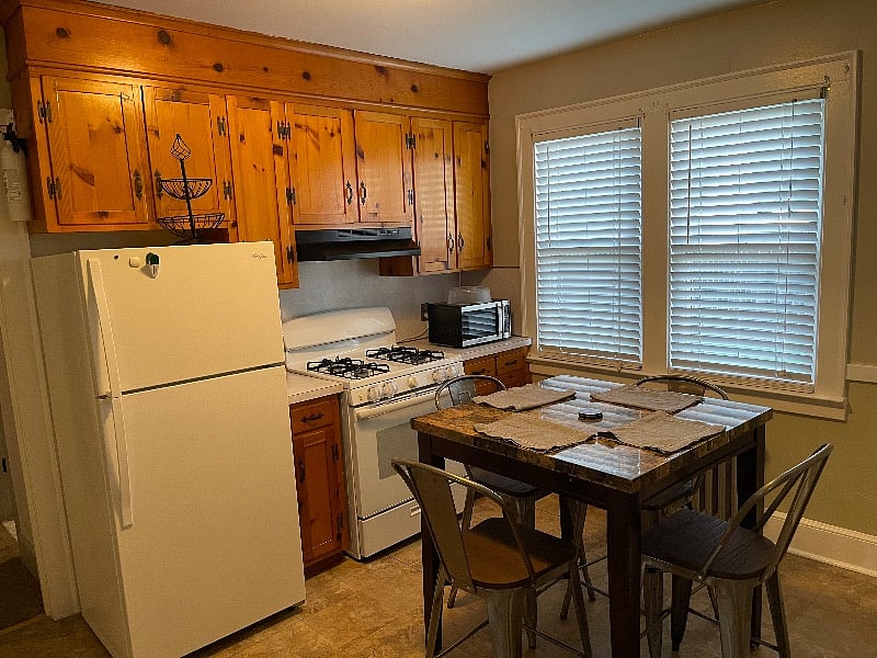 Full kitchen with gas stove and oven, microwave and fridge/freezer. 