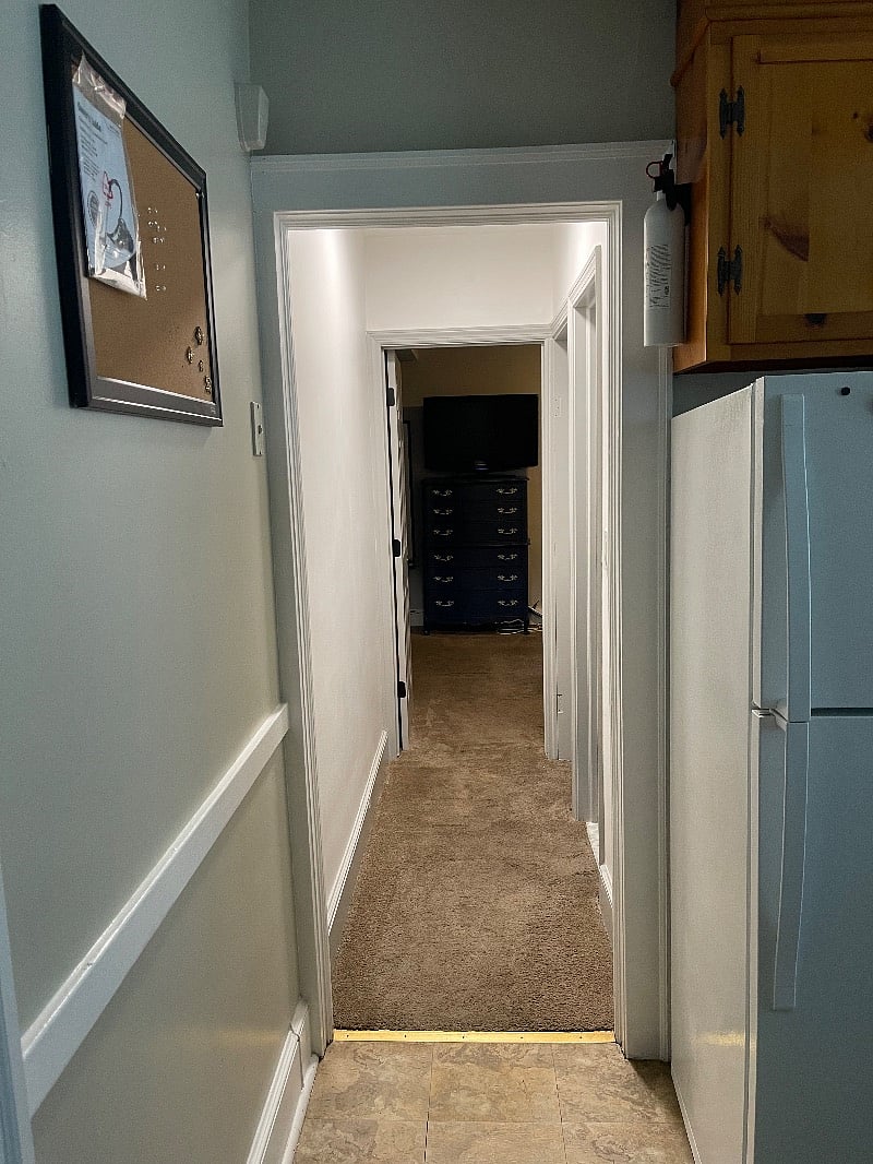 Hallway from kitchen leading to master bedroom. 