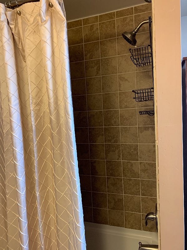Shower with deep bathtub.