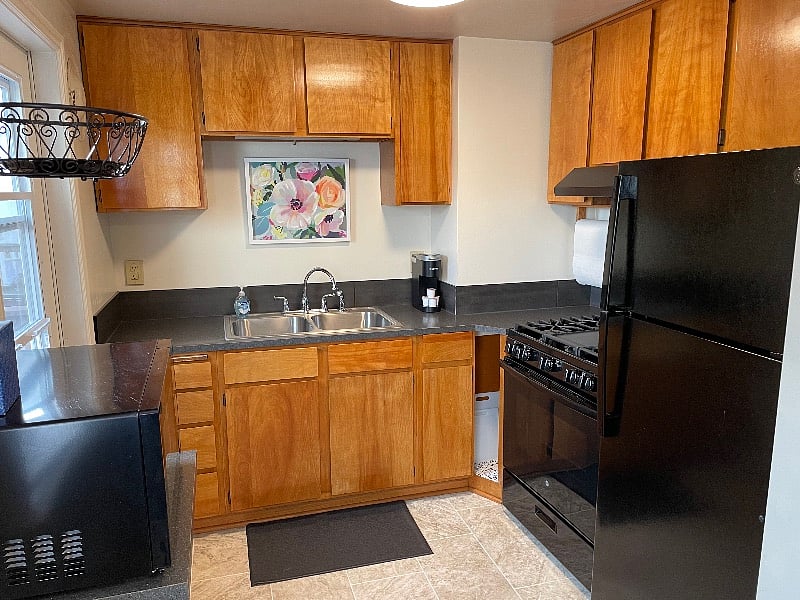 East side kitchen w/gas range leads to fabulous deck
