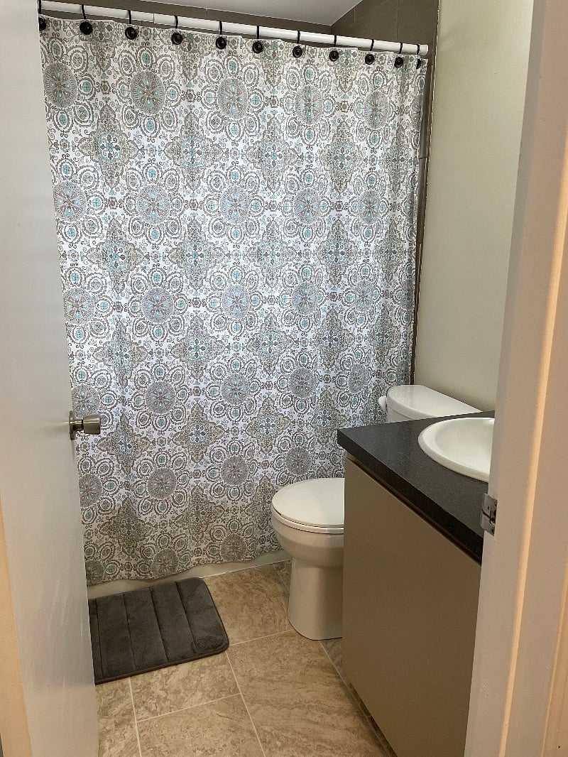 East side bathroom w/new sink, fixtures, and hotel quality tile