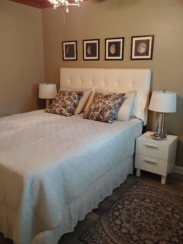 Comfy queen bed with twin night stands.