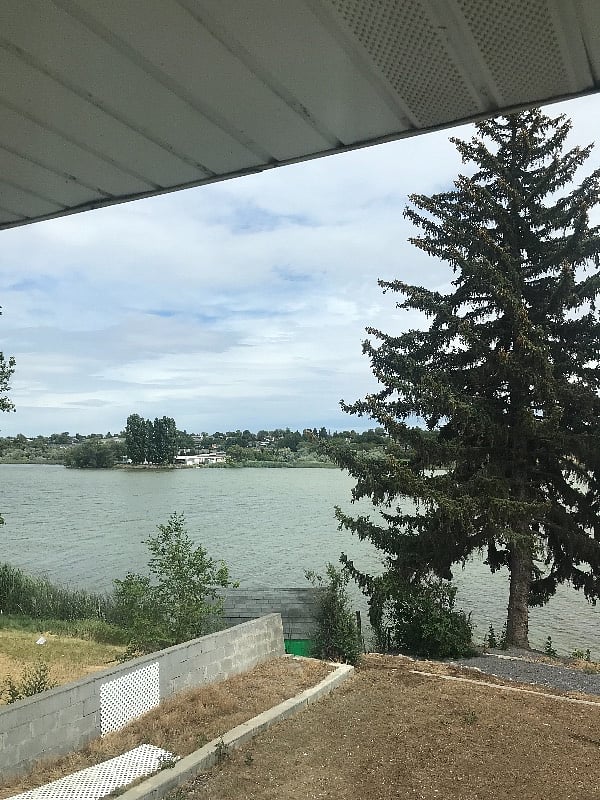 View of back yard and lake from livingroom