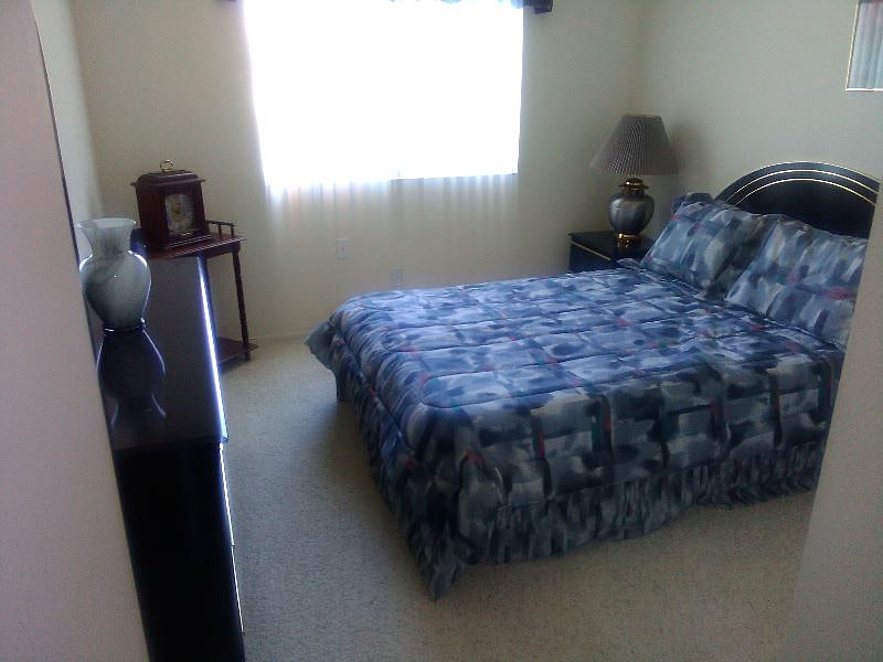 Full size bedroom with closet and window