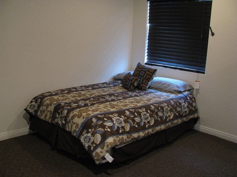 Bedroom with closet and desk