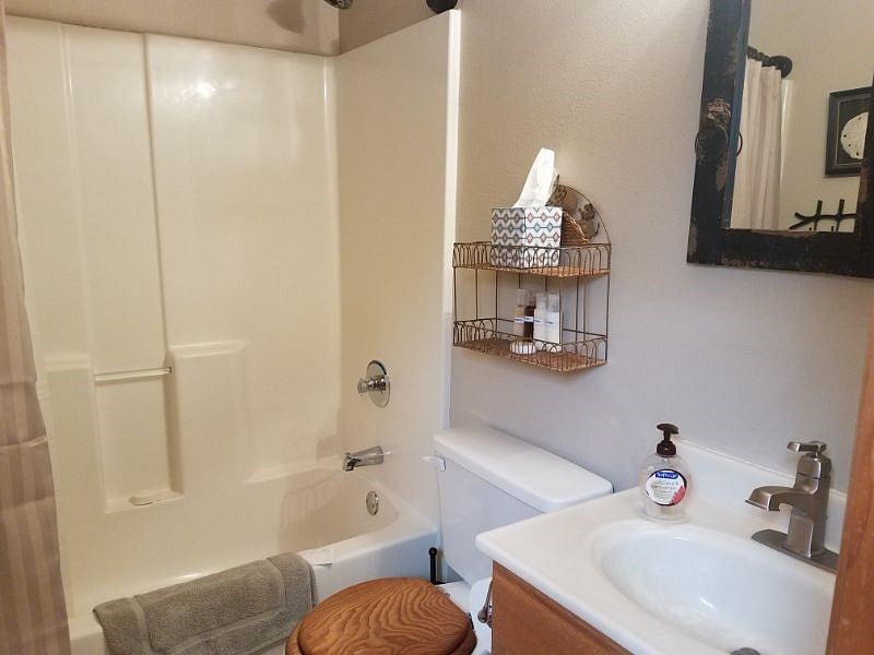Shower with towels and bed linens provided.