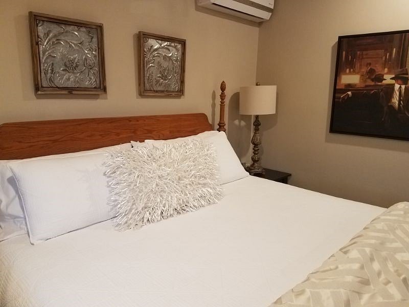Quality linens. Bedside lights and nightstands.