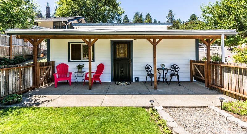 Private fenced yard. Covered porch. Private entry.