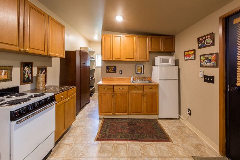 Kitchenette. Apartment fridge and stove.