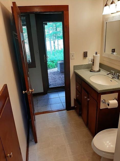 Inner hallway door open, outer storm door closed, from bathroom open door  1st floor
