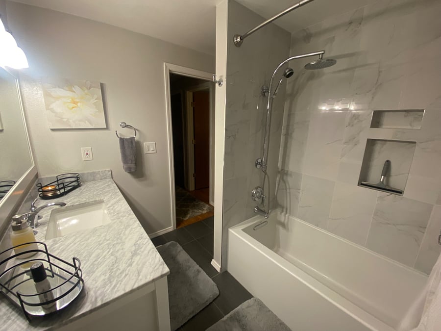 Bathroom was remodeled a few years ago and has a deep soaking tub and a rain shower.