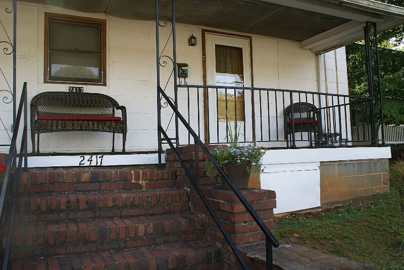 Steps to entrance. Apt on left.