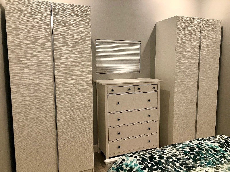 Large armoires and spacious dresser drawers for convenient storage.