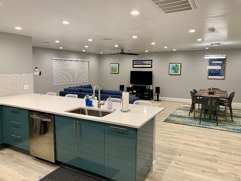 Large great room including kitchen, dining, and living rooms