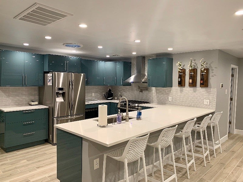 Beautifully remodeled kitchen with custom cabinets including soft close doors; quartz countertops; stainless steel appliances (including large French Door refrigerator); touch-free faucet; gas convection range; pot filler; and Keurig coffee maker.
