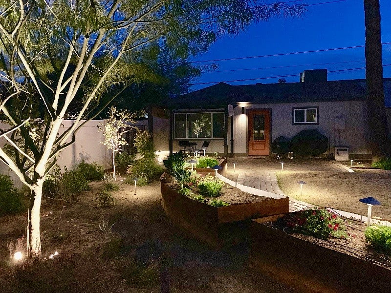 Gorgeous landscaping lighting illuminates your path home after a long shift and nights out. 