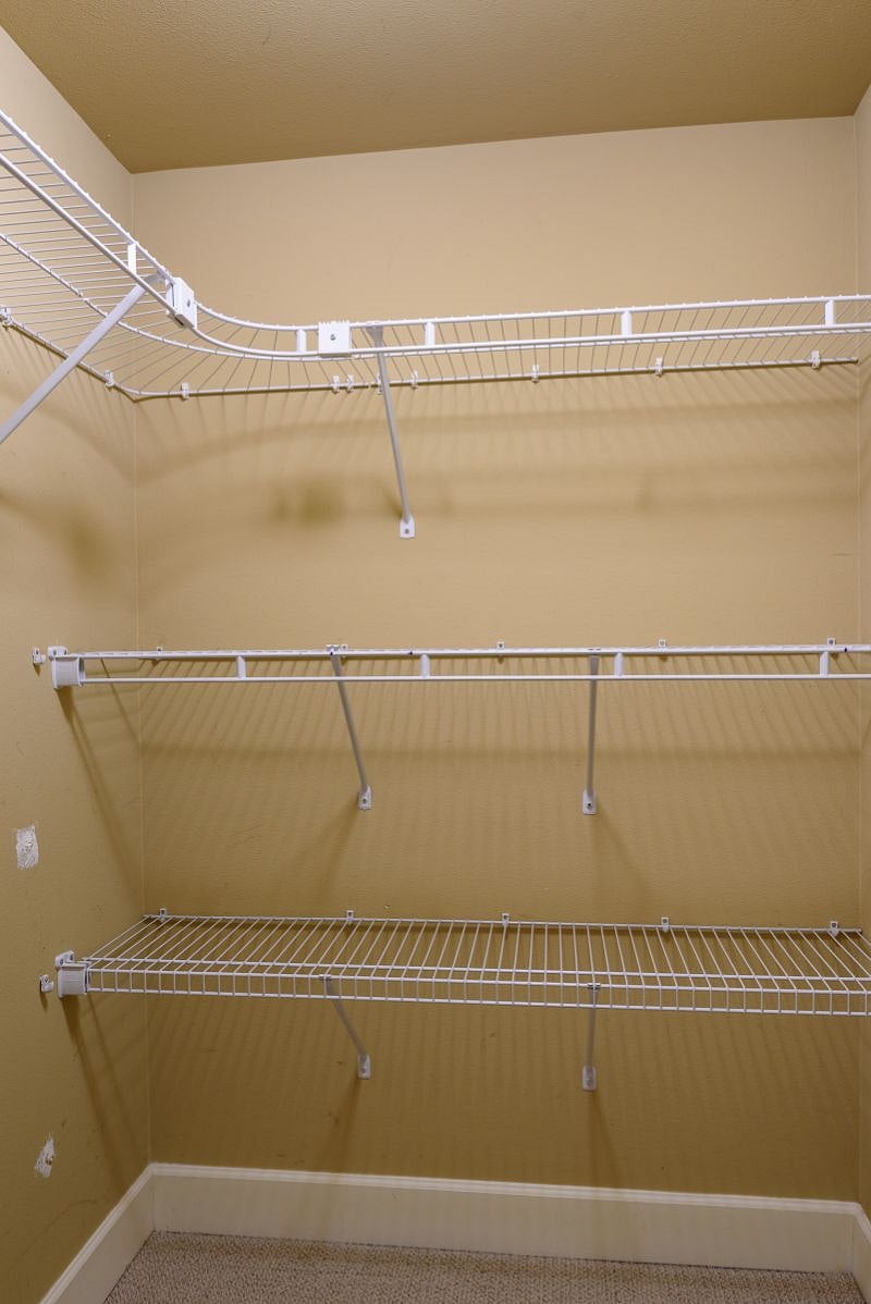 Full walk in closet with shelves