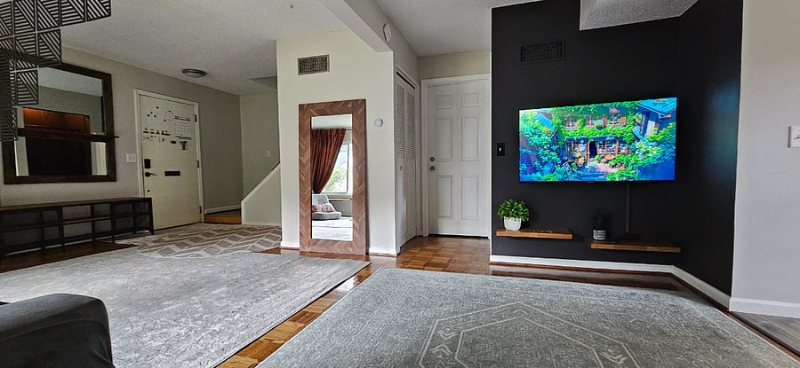 Living room is open to the rest of the home. Smart TV.