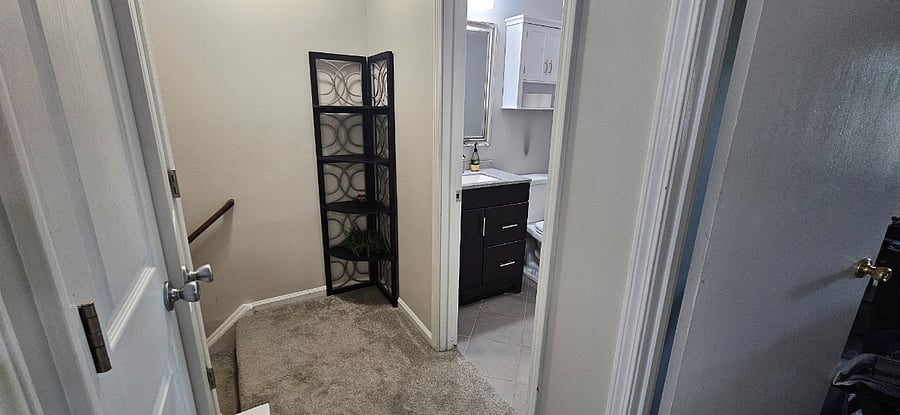 Upstairs hallway leading to bedrooms and bathroom