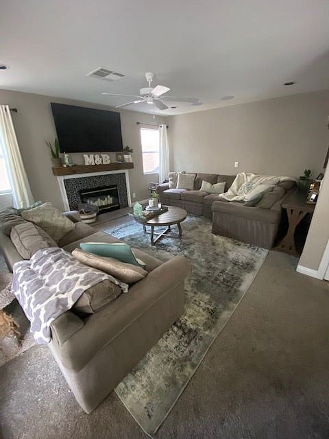 Spacious living room, with comfy Lazy Boy furniture, gas fireplace, smart TV, Xbox and ceiling fan