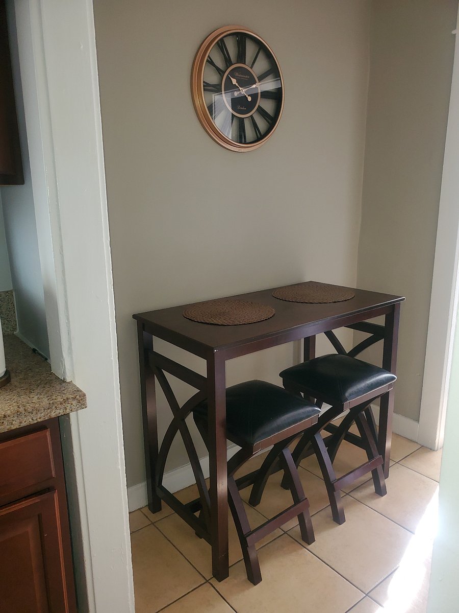 This area of the guesthouse is located in between the living room and the kitchen, arranged for a place to dine or workspace!