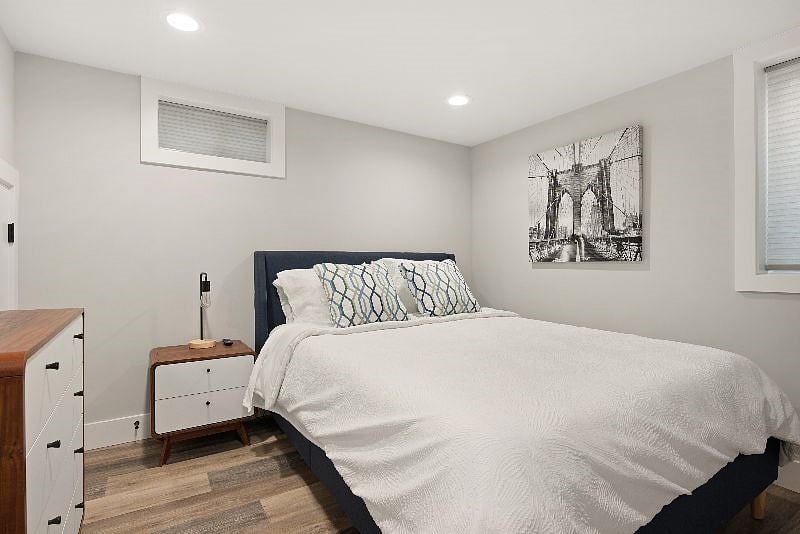 The guest bedroom features a queen sized memory foam mattress.