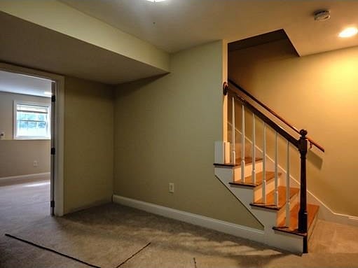 Larger living area downstairs, stairwell to 2nd bedroom