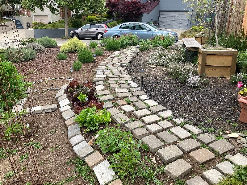 Another parking area besides driveway. Side of house with pathway to back gate to your private entrance and back door. Easier to transport stuff!