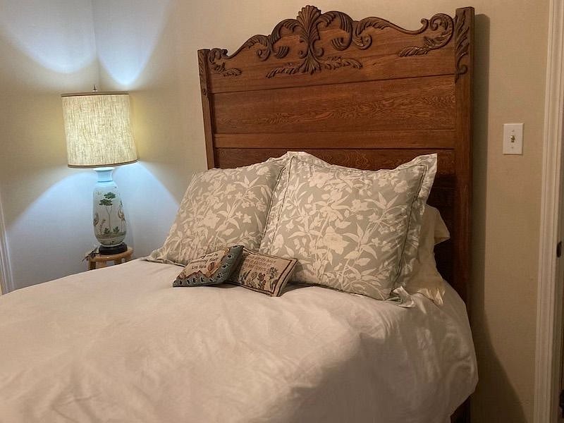 Antique full bed with down comforter