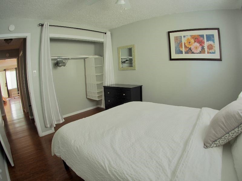 Second bedroom boasts ample closet space full lenght mirror, vanity mirror, chest of drawers dresser and memory foam queen bed. 
