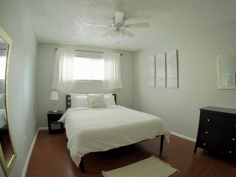 Master Bedroom identical to second bedroom with chest of drawers, closet and memory foam queen mattress