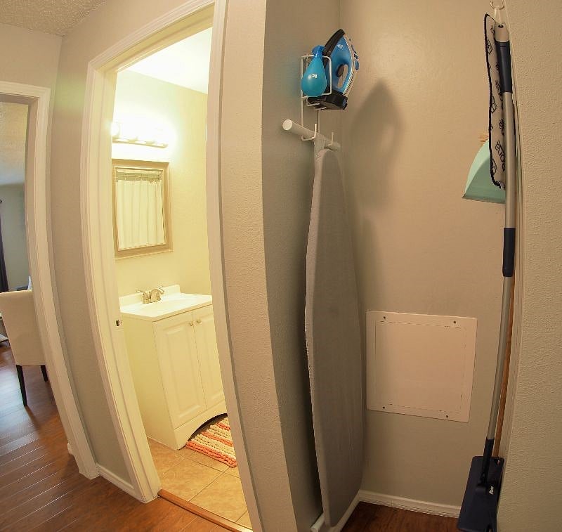 Additional storage in hallway for cleaning supplies, extra linens and belongings