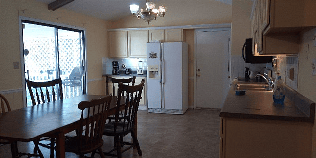 Kitchen opens to private deck.