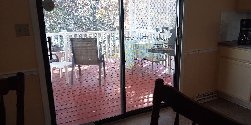 The deck, looks out to woods.