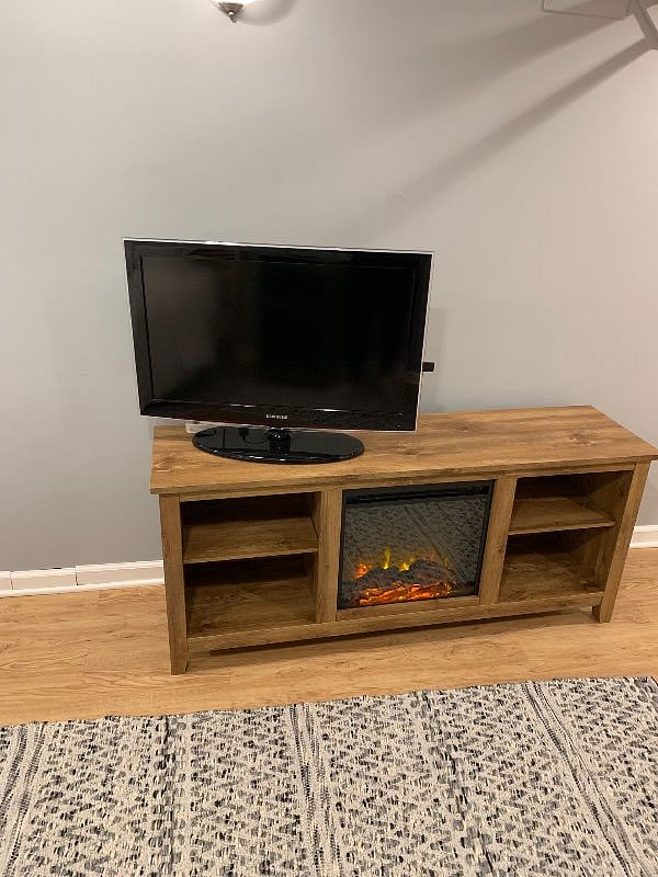 tv, storage and fireplace (that does send off heat).