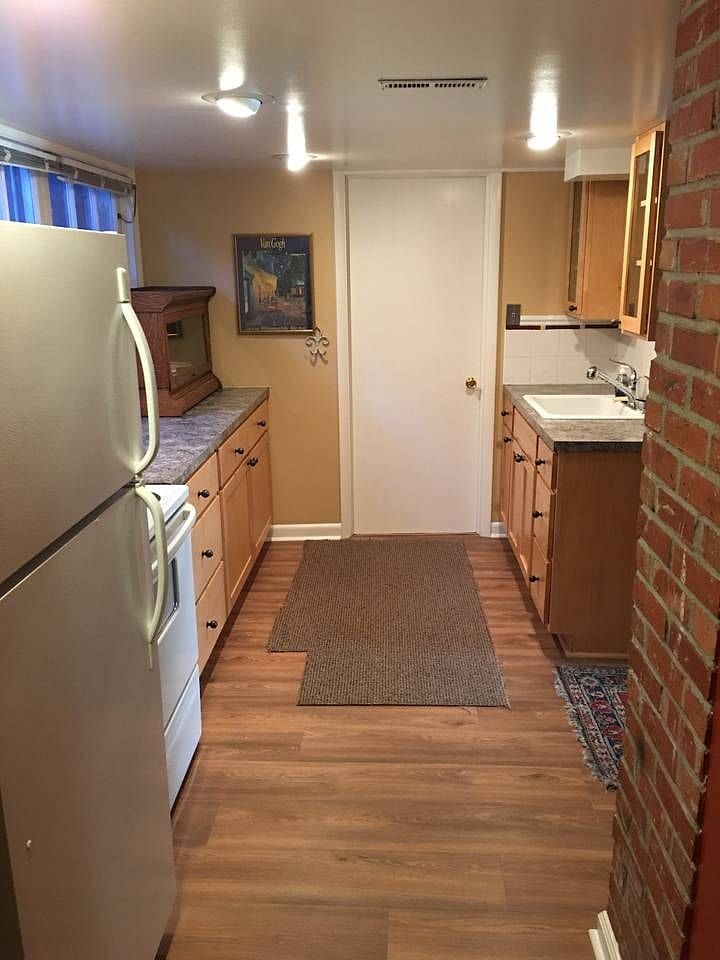 Remodeled kitchen with small eating area.