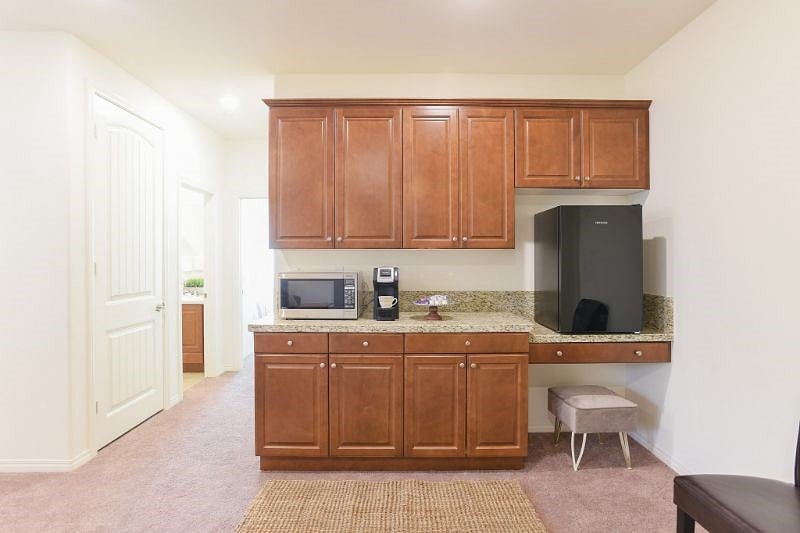 Kitchenette with lots of cabinet space and fridge also stack able brand new large washer and dryer in closet. There is also a compact refrigerator on the right that is not in the picture.