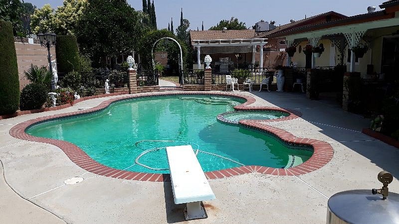 Backyard w/ Pool and Seating and Shade