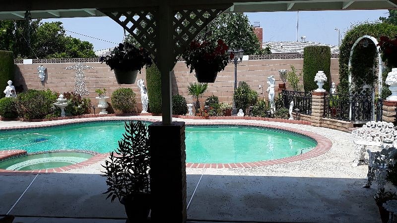 Backyard view w/ pool and shade