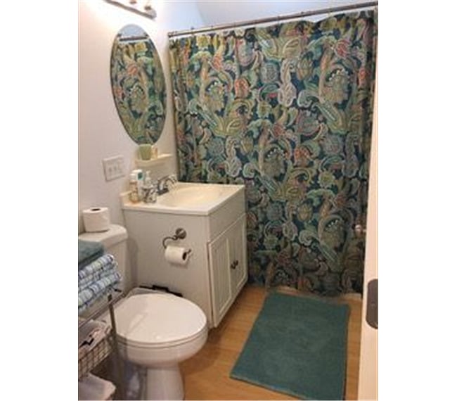 bathroom with tub and shower