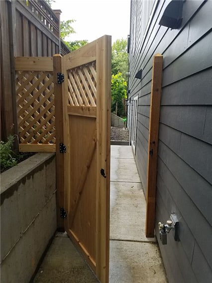 Private entry through a gated walkway.