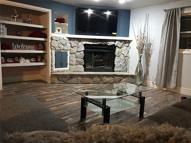 Real wood burning fireplace and 55 flat screen TV
