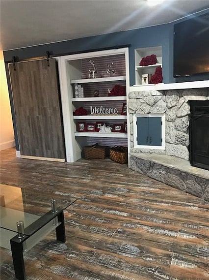 Custom barn door hides mini laundry. 