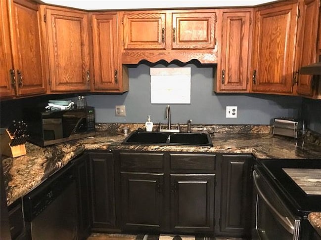 Recently updated kitchen with new countertops, sink, disposal and faucet. 