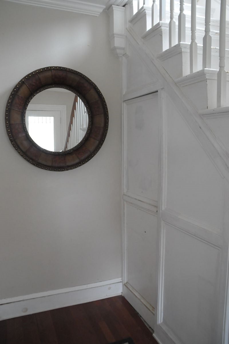 Door from entryway that leads to the basement with common laundry area