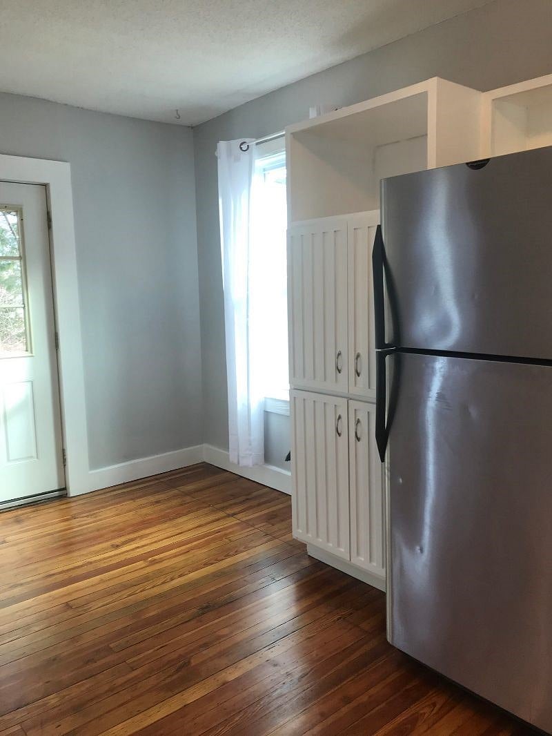 Kitchen with back door leading to backyard