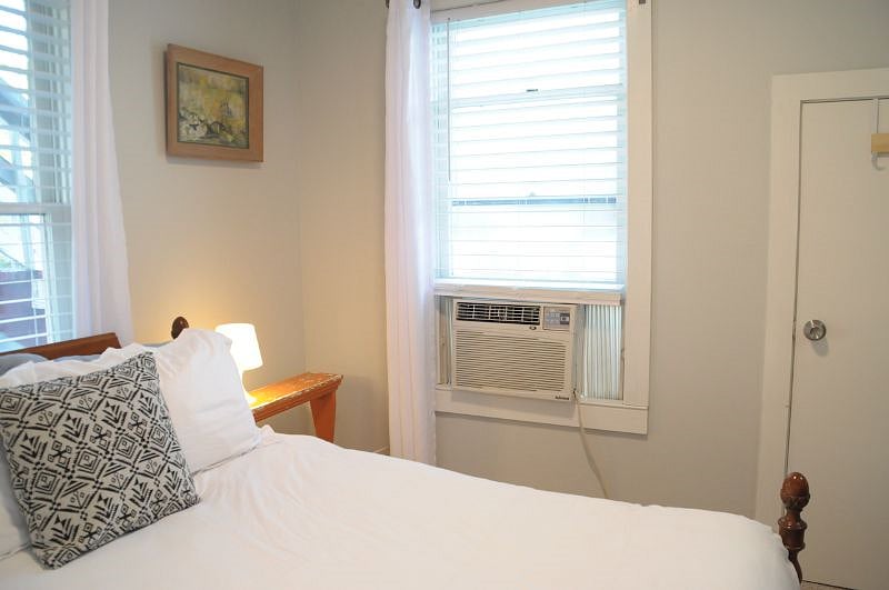 Room comes with an air conditioning window unit.