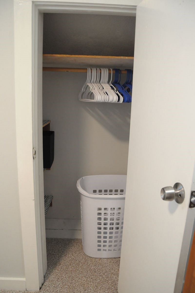 Small closet with shelves and hangers