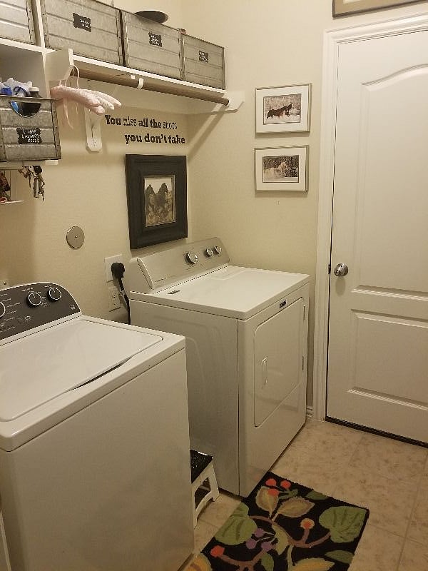 Laundry area: containers /storage above for laundry soap,etc